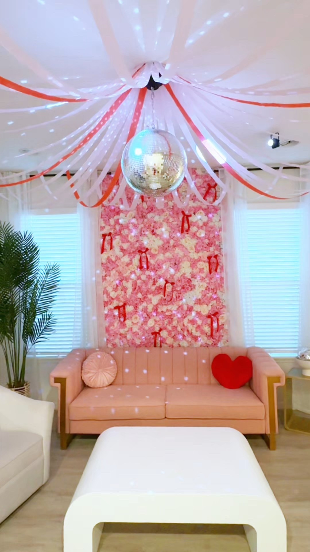Galentine’s Decor 💘 Cupid’s Cafe Disco 🪩 flower backdrop, pink sofa, streamers, disco ball and lights too!

#LTKValentine #LTKHome