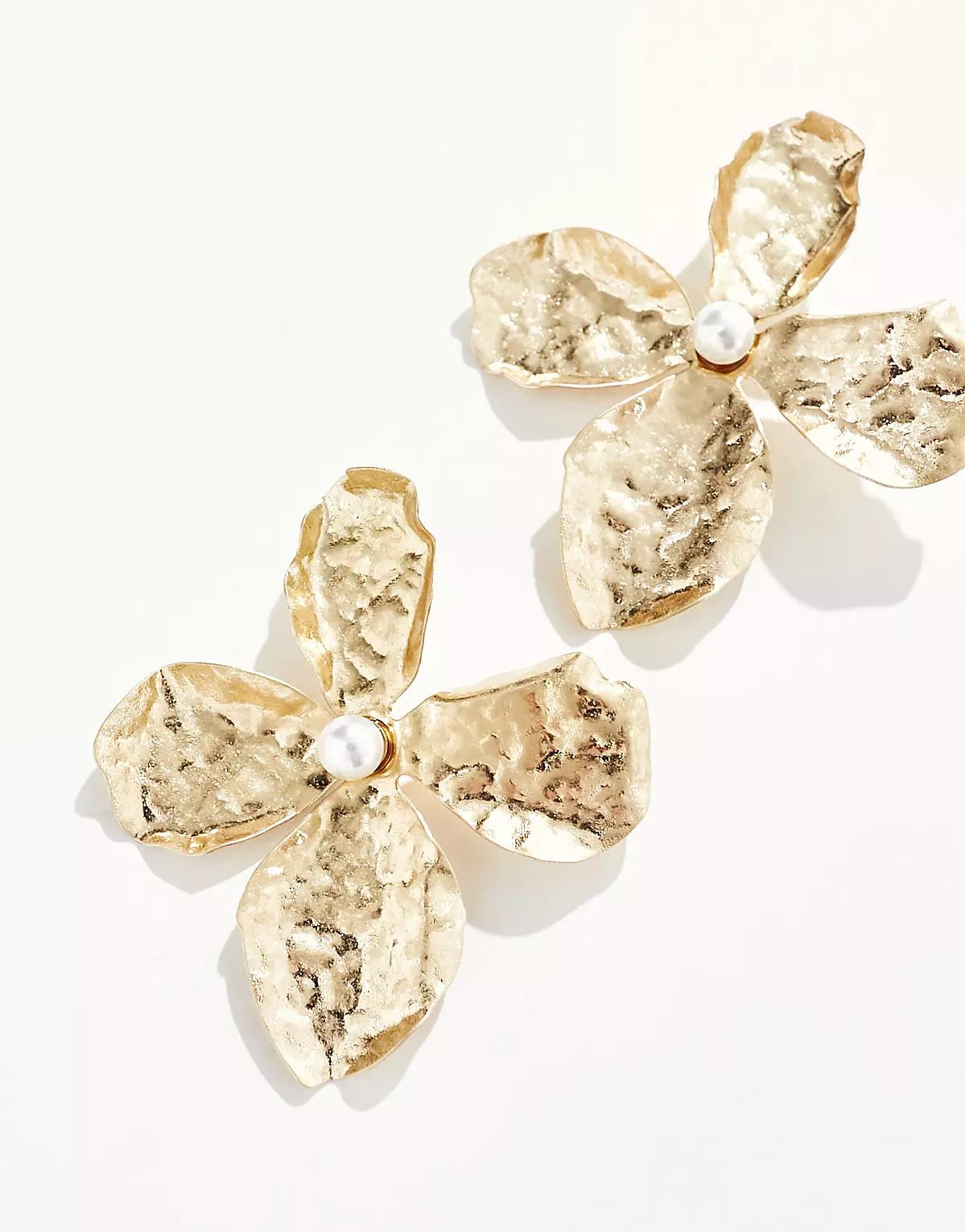 ASOS DESIGN oversized stud earrings with hammered floral design in gold tone | ASOS | ASOS (Global)