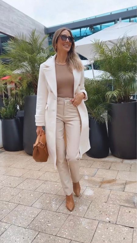 Gorgeous white trench coat! A must have staple piece in your closet
Make any outfit so elegant and chic
I’m 5’9 wearing a size small
These leather pants have an amazing quality and it fits true to size 
I’m wearing a size 2 long
Paired with the perfect camel boots
They’re comfortable and beautiful 
Fits true to size 

#LTKstyletip #LTKshoecrush #LTKitbag