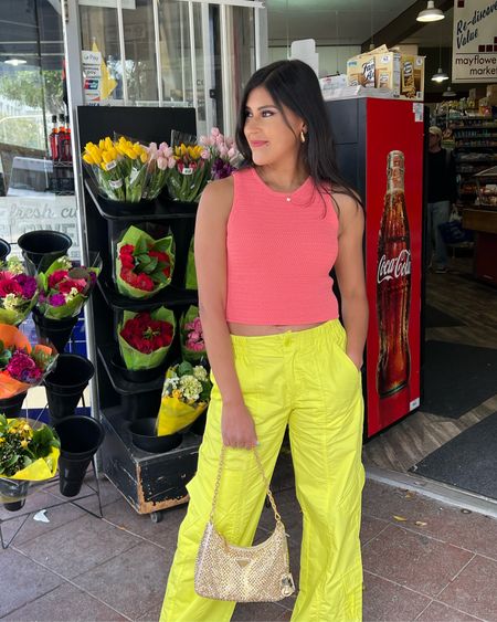 Colorful 🌈 cargos that won’t break the bank if you’re on the fence about this new trend! The fit is TTS  I paired them with a coral top and gold ✨. These chunky earrings are my latest obsession. Lipstick 💄 as seen in “Ingleside.” #cargopants #summeroutfit #louboutins #pradapurse #petitefashion

#LTKSeasonal #LTKunder100