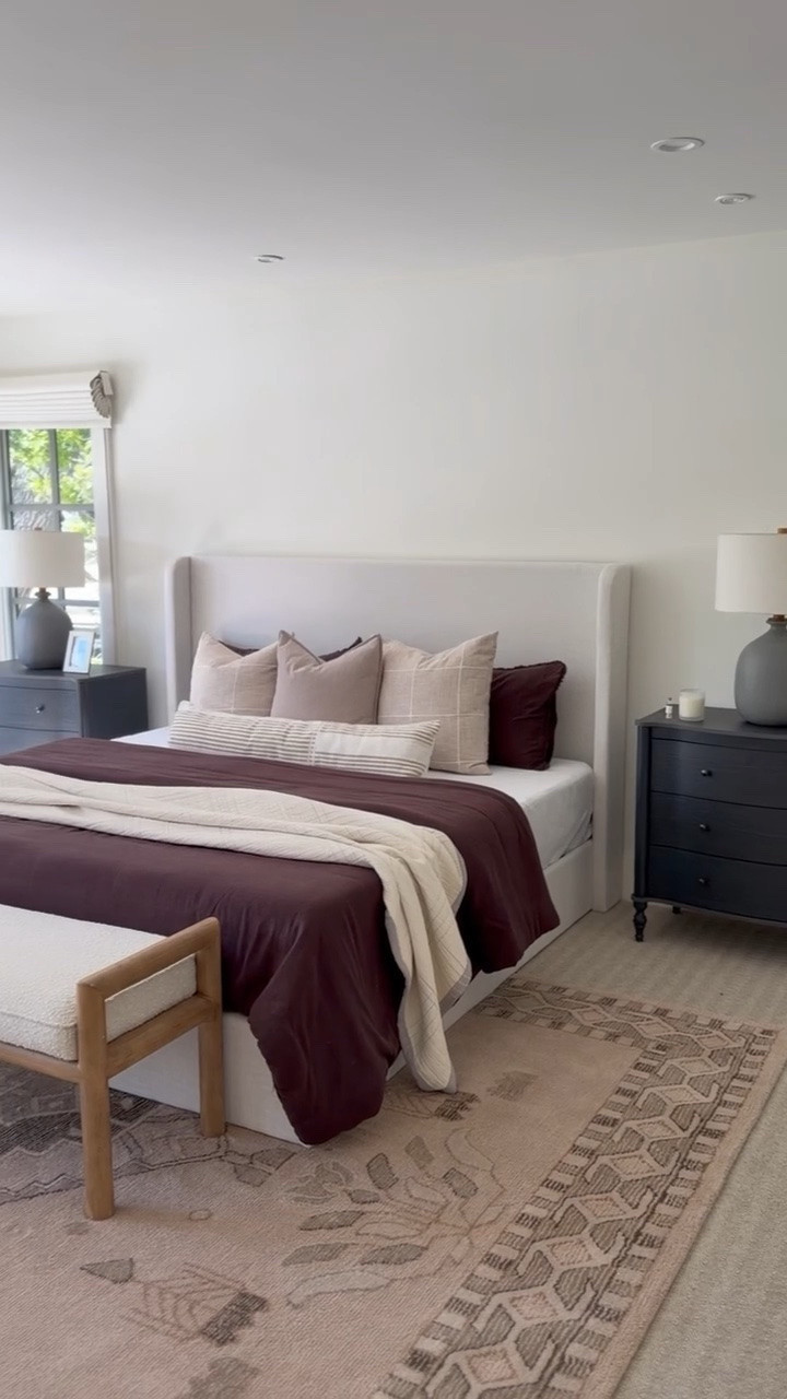 This upholstered bed and black nightstands are such a designer look for less!

#LTKHome