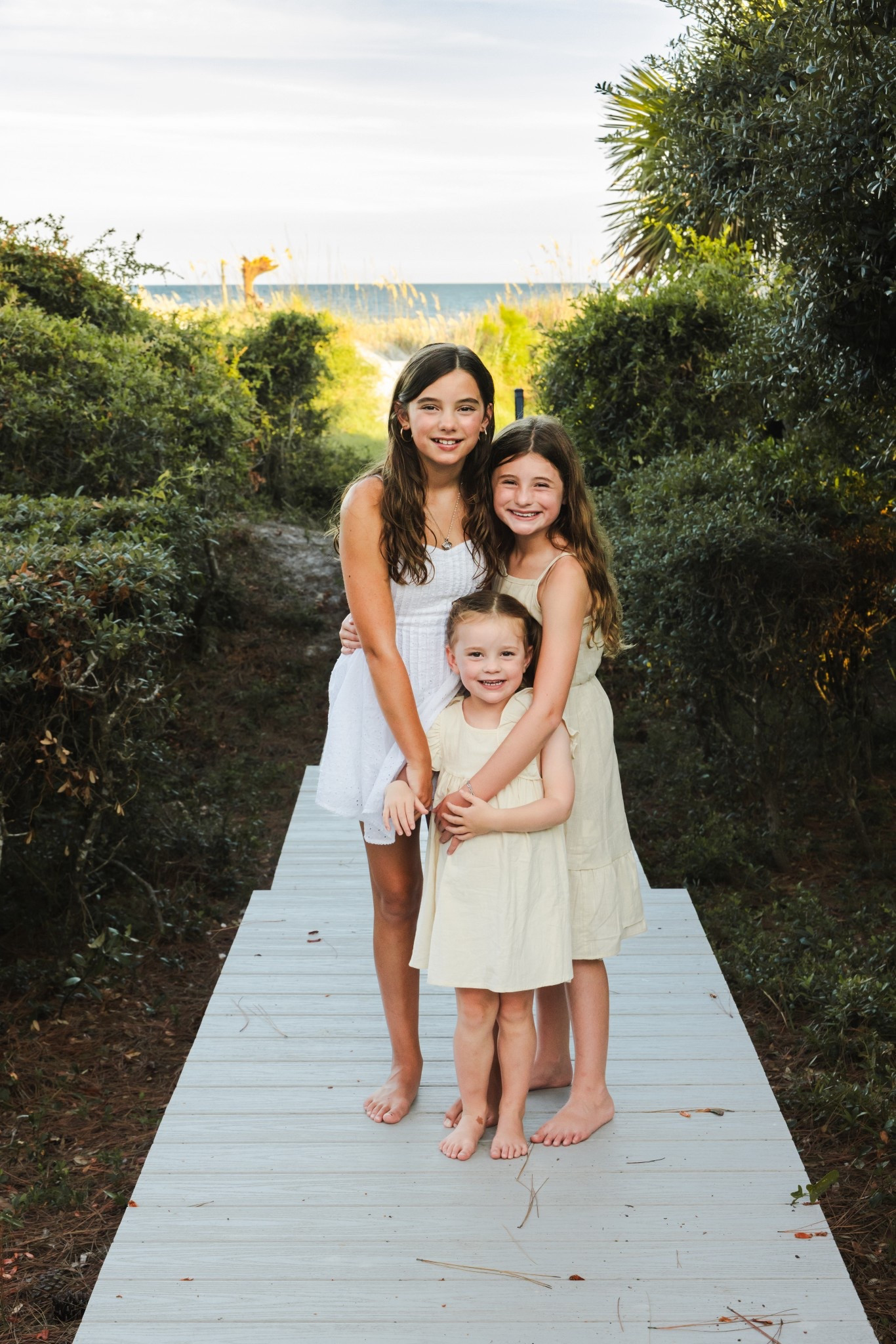 Coordinating matching Sister Outfits for beach family photos - tan, white, khaki theme - photos on Hilton Head Island. 

#LTKKids #LTKFamily #LTKFindsUnder100