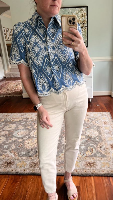 Summer essential blouse embroidered open scallop worked Cotten blend. On sale now. Neutral straight leg jeans. Easy travel capsul pieces. Add to any summer staples. Dress up or down  

#LTKTravel #LTKSaleAlert #LTKWorkwear