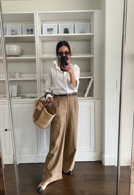 Tan linen trousers. I’m wearing an Xs. These are so comfortable and have a nice high waist. 

Basic white button down shirt. 

Black skinny belt.


Loewe medium basket.

Chanel cap toe ballet flats. 

Spring office outfit 
Spring workwear 
Office look
Realtor outfit 
High waisted linen trousers 

#LTKSeasonal #LTKworkwear #LTKstyletip