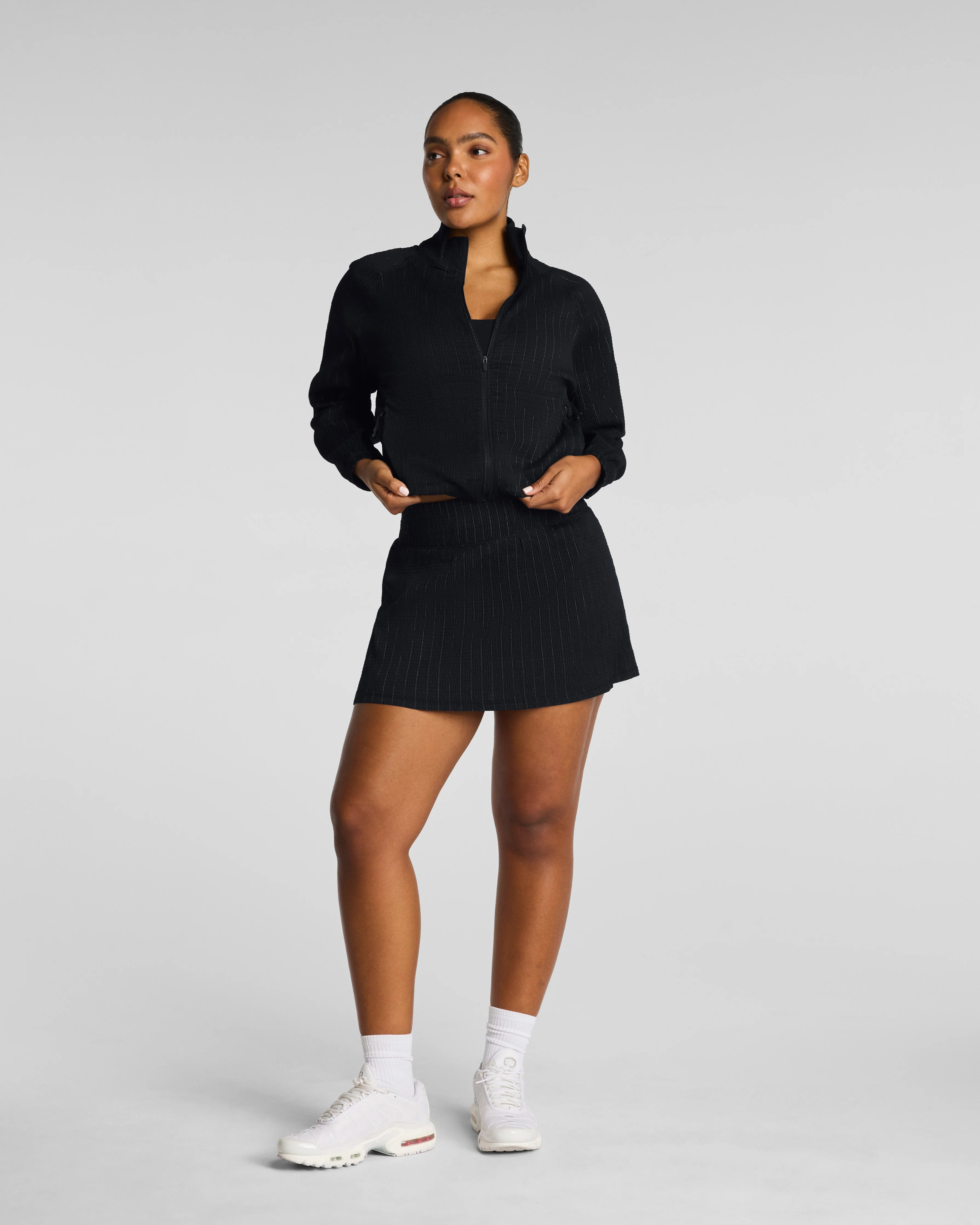 Spanx Women's SPANXshape® BoostUp Glow Weave Skort, 14" in Black | Spanx