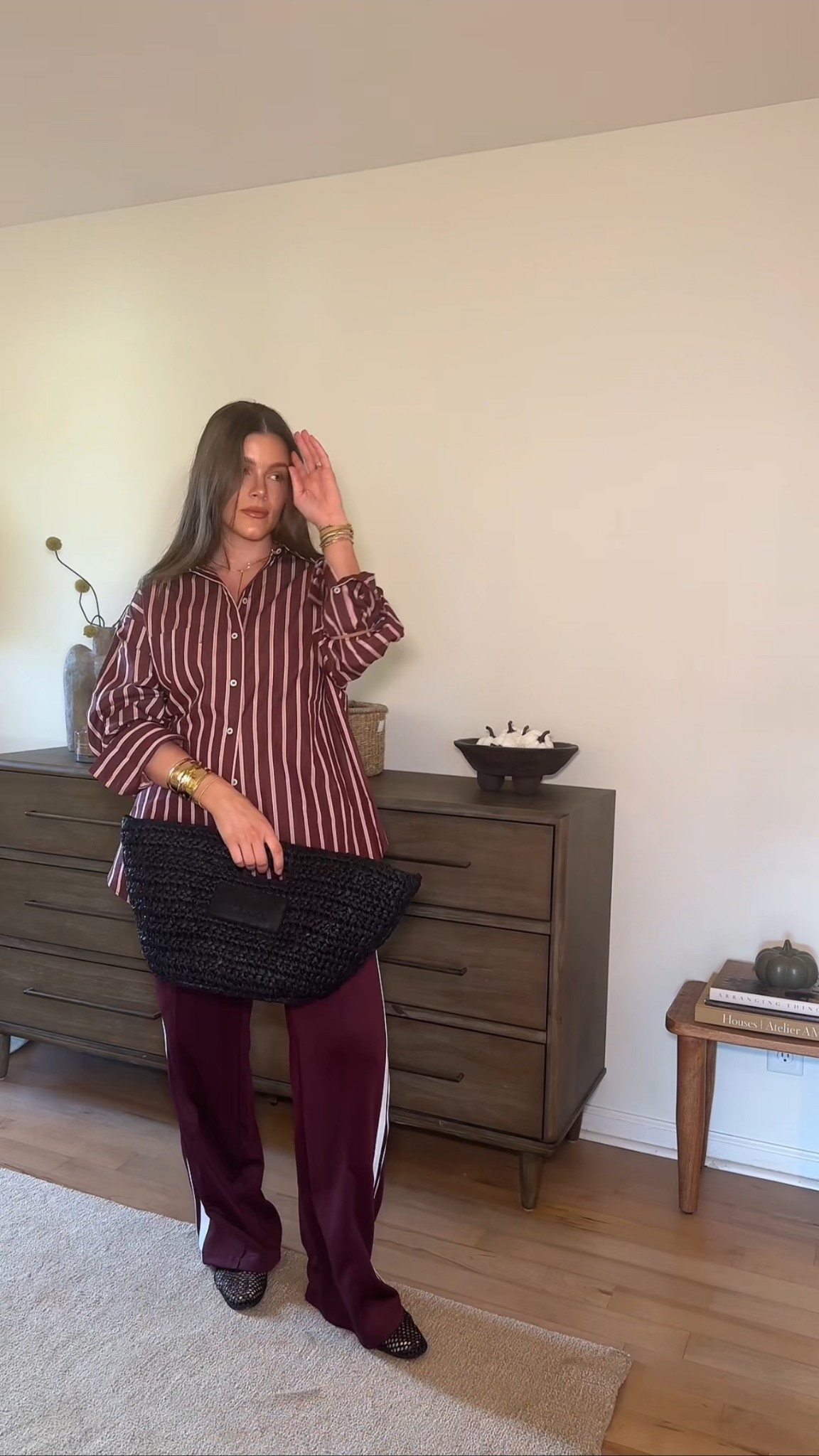 Effortless fall fit 🍂 Mixing sporty and chic with an oversized striped button-down, relaxed trousers, and a woven clutch — the perfect elevated casual look for the season. Wearing a size small in the top and medium in the bottoms. #OOTD

#LTKStyle #LTKFallFashion #LTKOutfit #OOTDFall #EffortlessStyle #ChicAndCasual #FallOutfitInspo #StreetStyle #LTKTrend #StyleInspo
