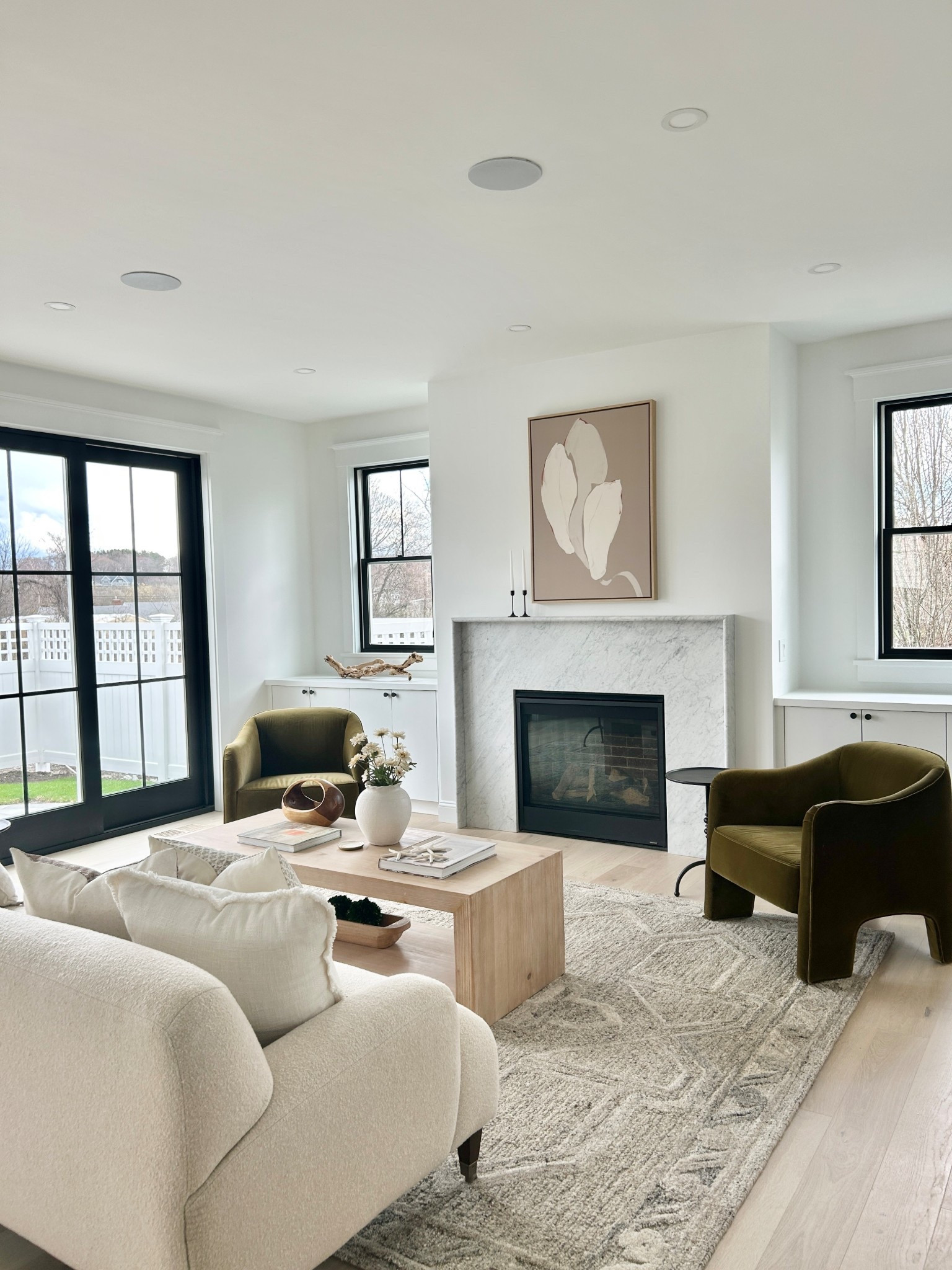 Modern organic furniture.  Olive green accent chairs.

#livingroom

#LTKHome
