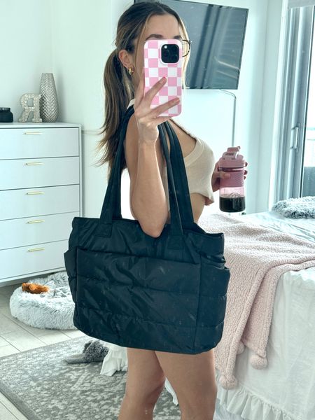 THIS Amazon tote bag! 
i’m so impressed with the quality of this! has a bunch of compartments including one for your laptop! also has a strap to put over your carry on. the price is such a steal. comes in 2 other colors 🫶🏻