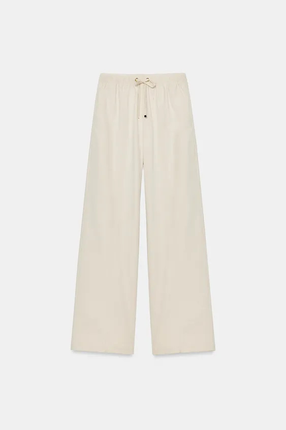 High-waist trousers with an elastic drawstring waistband. Front pockets and false welt back pocke... | Zara UK