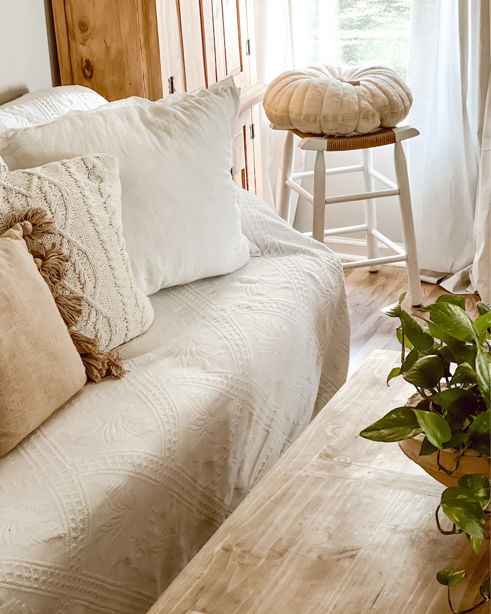 Simple & cozy fall living room decor. Textures are so cozy in fall- you can decorate with textures by using pumpkins, pillows & blankets/throws. You can also easily change the look of your couch using an oversized bedspread or blanket. 

#LTKSeasonal #LTKhome #LTKstyletip