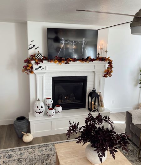 Living room/fire place Fall & Halloween Decor 🎃🍂 Linked my Crate & Barrel vases. Amazon garland, and other decor pieces! 

#LTKHalloween #LTKhome #LTKSeasonal