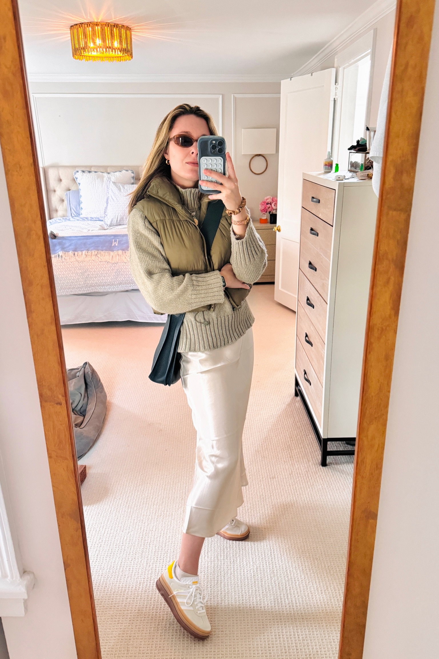 Dressing down a silk skirt for daytime in spring

Skirt from H&M
Sweater from Zara
Cropped puffer vest from Amazon
Shoes from Adidas (Sambas Gazelle Bold in Light Yellow)
Sunnies from H&M
Bag from Hermes

#LTKSeasonal #LTKstyletip #LTKshoecrush