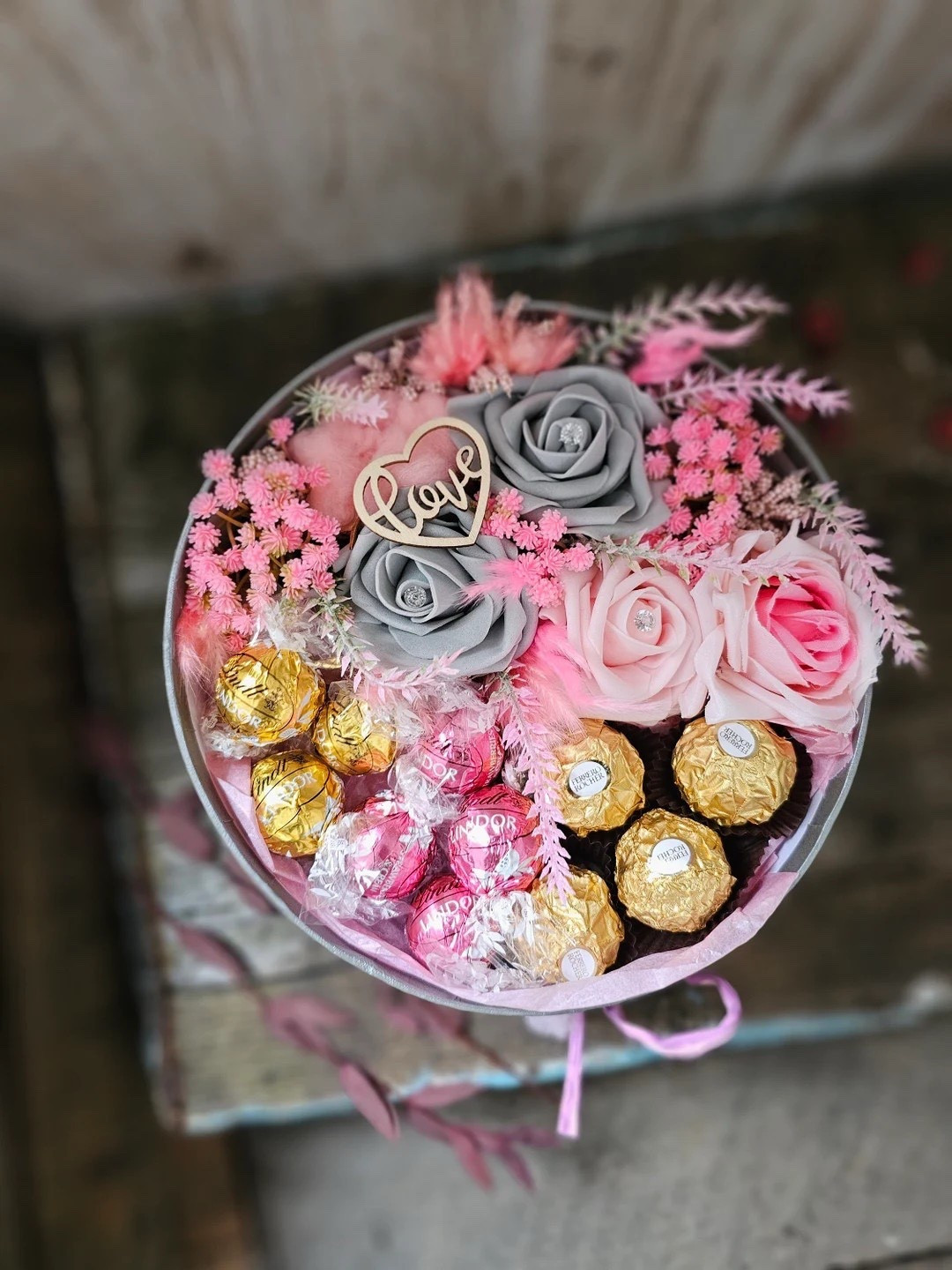 Looking for a gift that feels extra special? This pink and silver keepsake box by BlossomBeGifts is the perfect mix of sweet and stunning. Filled with artificial and dried florals, soft pampas accents, luxe satin details, and 11 indulgent chocolates including Ferrero Rocher and Lindt Lindor, it’s beautifully arranged in a silver hat box and finished with a wooden heart charm. A thoughtful, ready-to-gift piece that’s perfect for birthdays, graduations, Valentine’s Day, Mother’s Day, or anytime you want to make someone feel truly celebrated. 💗✨

#LTKgifts #GiftIdeas #LuxuryGifting #FlowerGift #ChocolateLovers #ValentinesGift #MothersDayGift #BirthdayGift #BlossomBeGifts #LTKhome

#LTKSeasonal #LTKFindsUnder50 #LTKHome