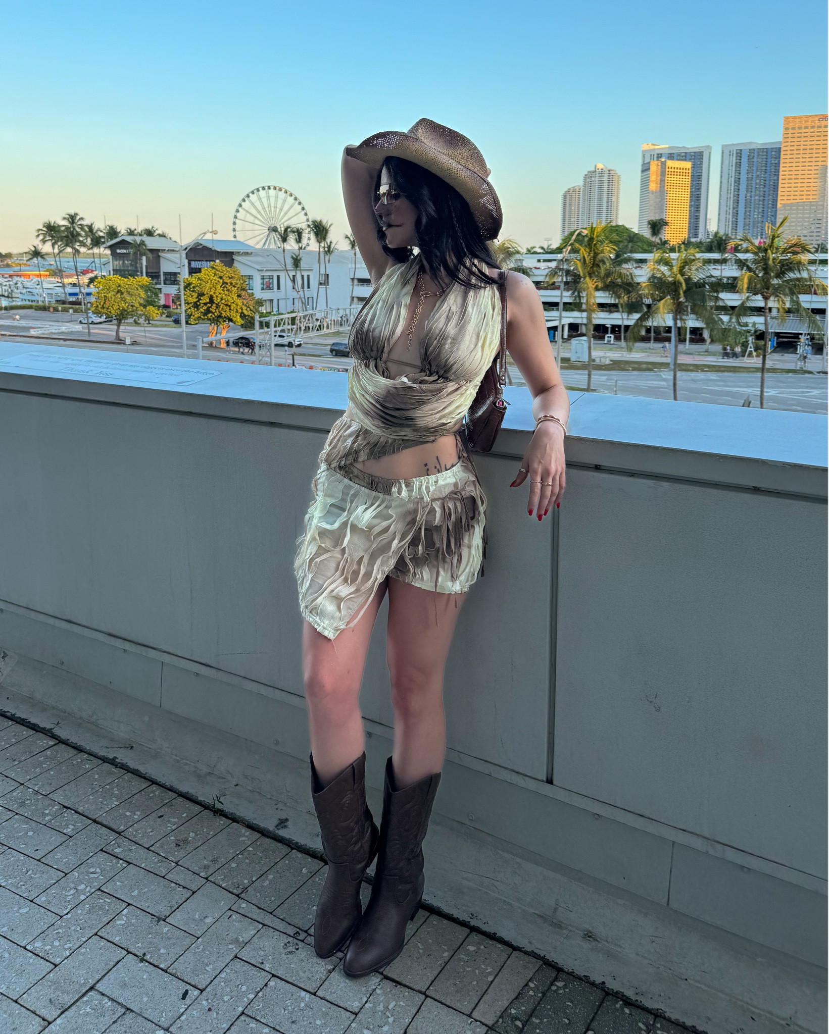Bad Bunny Most Wanted Tour concert outfit 🤠🤎

This frayed halter top and skirt set matched the Western vibe of the concert so perfectly! Finished off the look with some cowboy boots, cowboy hat, gold jewelry, brown shoulder bag, and rimless sunglasses ✨

(This outfit also works great for music festivals!)

#LTKFestival #LTKMidsize #LTKSaleAlert