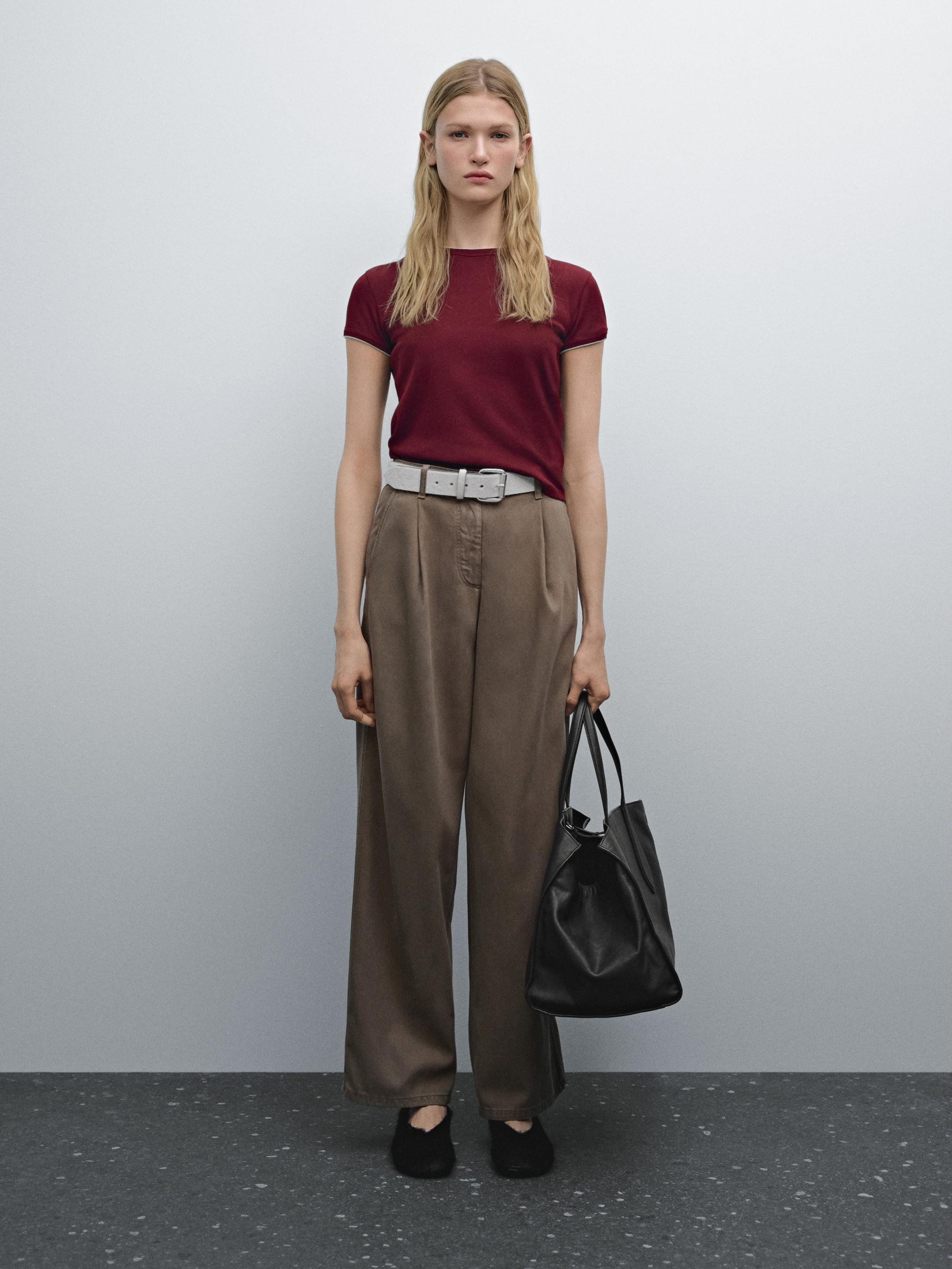 T-shirt made of 100% cotton. Crew neck. Short sleeves. Contrast trims. This garment is shorter th... | Massimo Dutti US