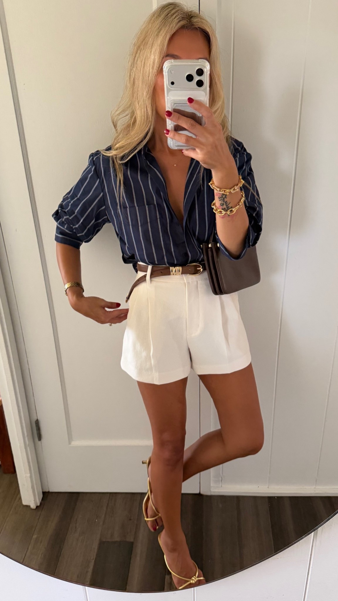 This button down has already scrunched sleeves YESSS! Pricey but I love it and bought the white too! Wearing an xs top and size 0 petite mini size in shorts.

#LTKootd #LTKOver40 #LTKPetite