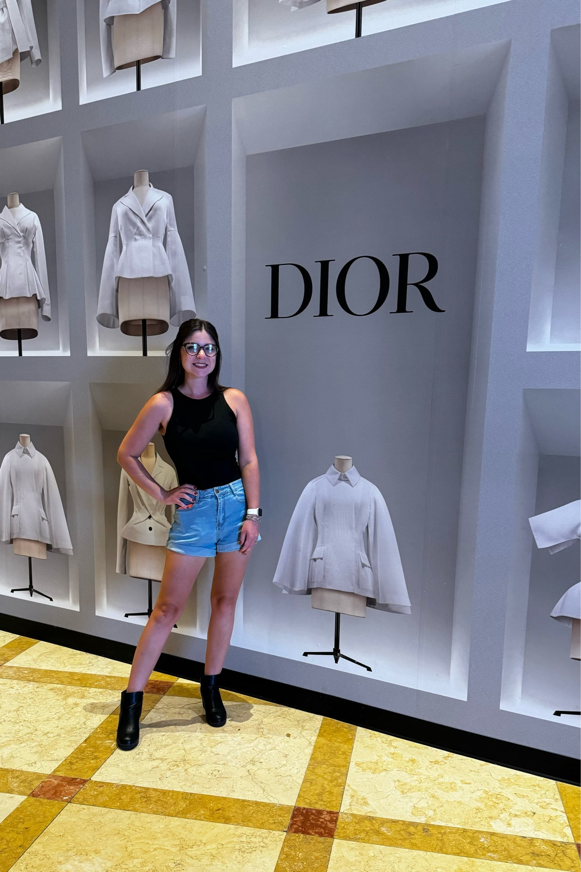Black bodysuit. High-waisted denim shorts. Black booties. Amazon Style. Vegas Strip. Dior Wall. 

#LTKfindsunder50 #LTKtravel