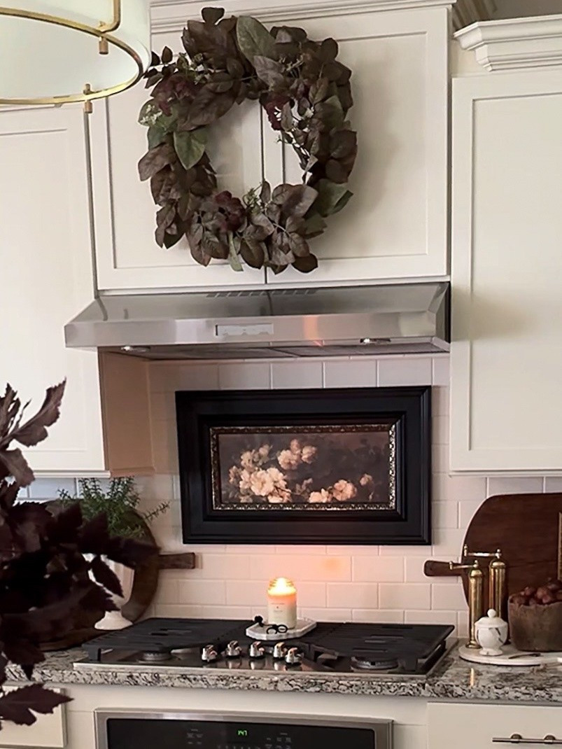 Fall Kitchen
Less like a workspace and more like a cozy lived-in room🤎

Burgundy wreath, fluted cream vase, plum stems, brass salt & pepper grinders, round marble board, marble bowl with lid, vintage wood bowl, vintage cutting board, dried pomegranates, island pendants, green floral crock, rechargeable lamp, black serving board, wood utensils, green olive oil bottle, gold pourers 

#LTKstorytime #LTKSeasonal #LTKHome