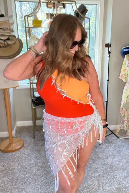 Okkkk.. a mini sarong with fringe and sequins! That would be a BIG Yes!

Available in 2 sizes! I will link my one shoulder swimsuit too!

#LTKSeasonal #LTKswim #LTKstyletip