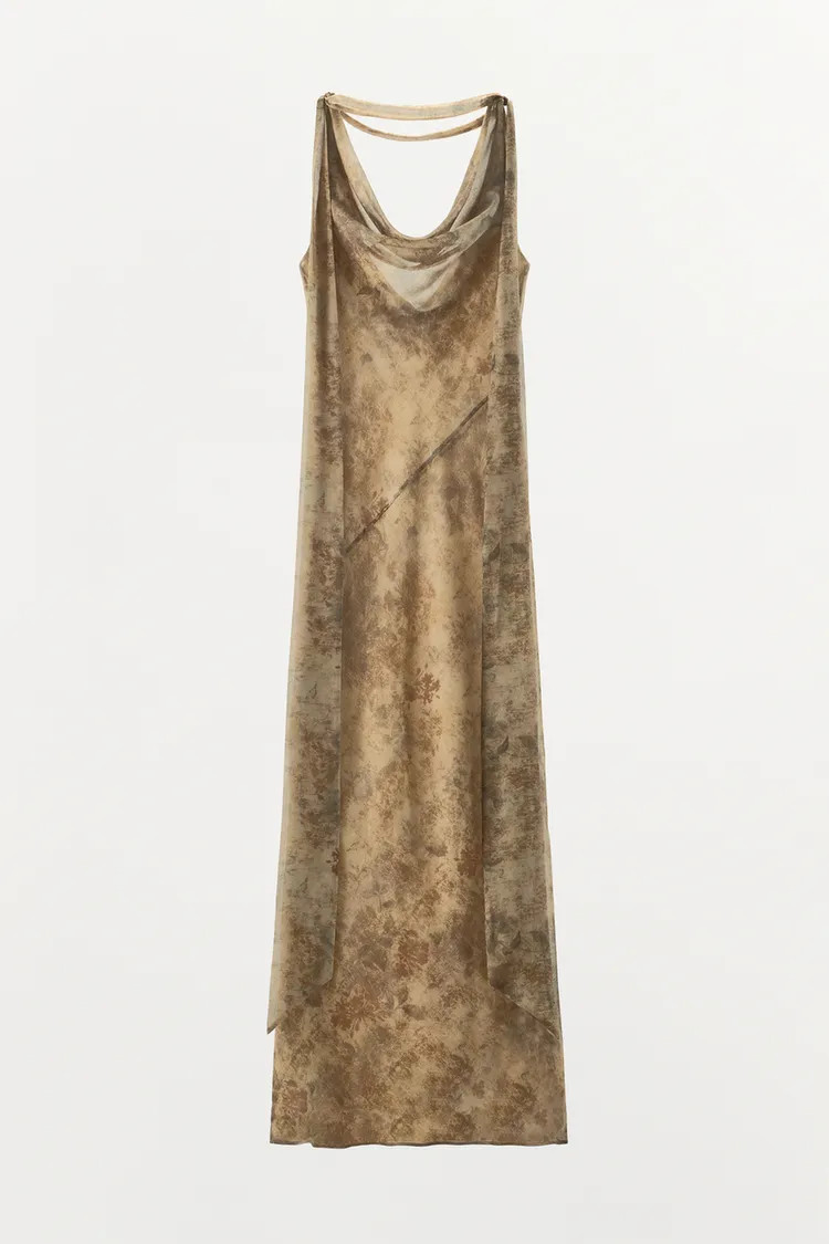 Flowy long printed dress featuring a round neckline and straps. Detailed with crossover straps at... | Zara US