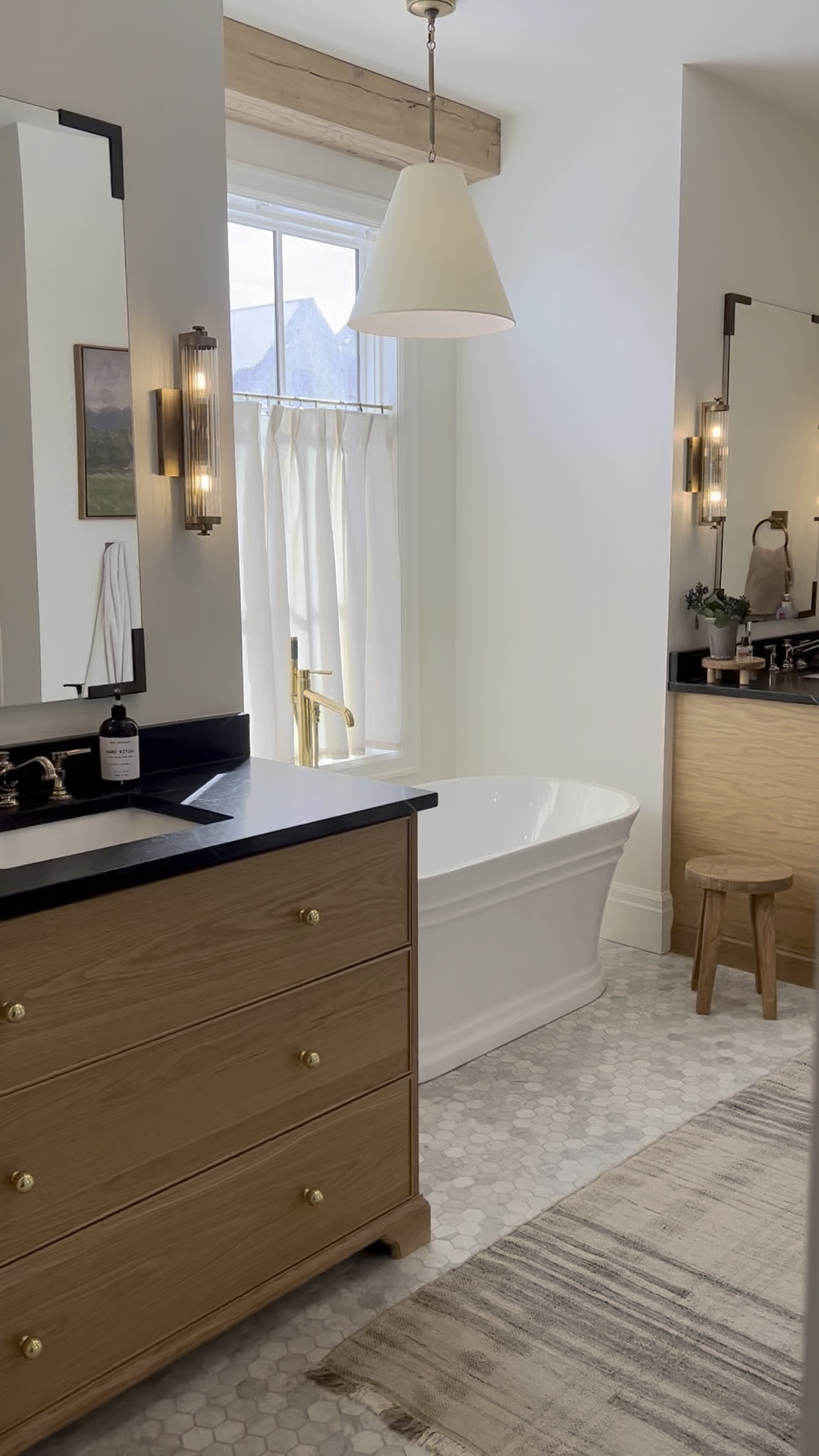 Just hung these cafe curtains from Curtarra. They are so beautiful with pleats and a linen blend. They were affordable and add such a completeness to our space. Bathroom home design. Marble flooring. Brass and ribbed wall sconce. Hanging pendant. Free standing bath tub. Bathroom design. Wall artwork from Amazon. Rejuvenation runner rug. Brass tun filler  

#LTKWatchNow #LTKHome