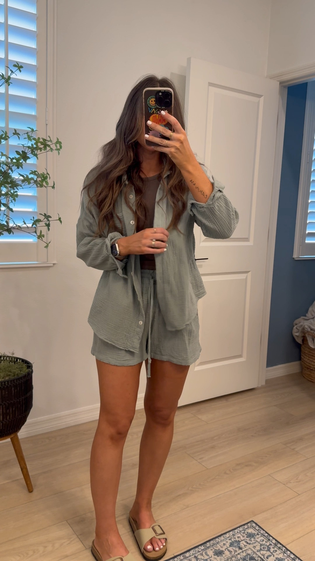 Tts small. I wore this set a LOT last spring and summer. Great quality! I wash and hang to dry and then steam it. I wore it to the beach all the time for evening beach walks living so close to the beach.. it was cute as a coverup too! And I love that you can wear the shorts alone over a swim suit or wear the button up even with jeans. Very versatile and wonderful material!!