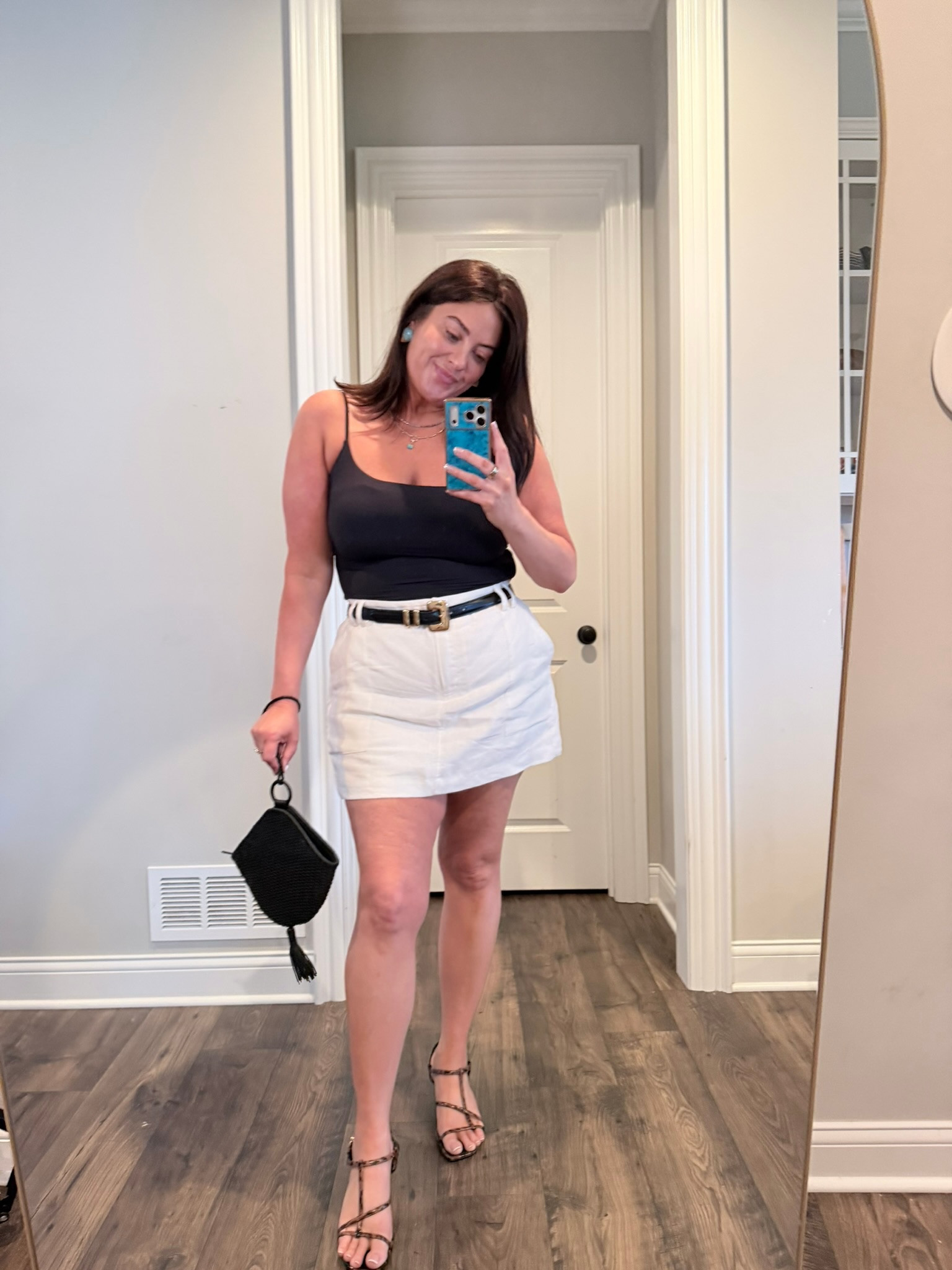 This is my favorite Amazon top and I have it in so many colors. In XL, take true size. I love a black and white outfit and this linen skort is a good find from Banana. Runs a little large. Add a pop with a fun earring!