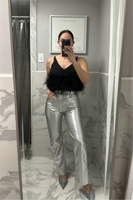 The most fun feather top and silver jeans! Both are true to size 