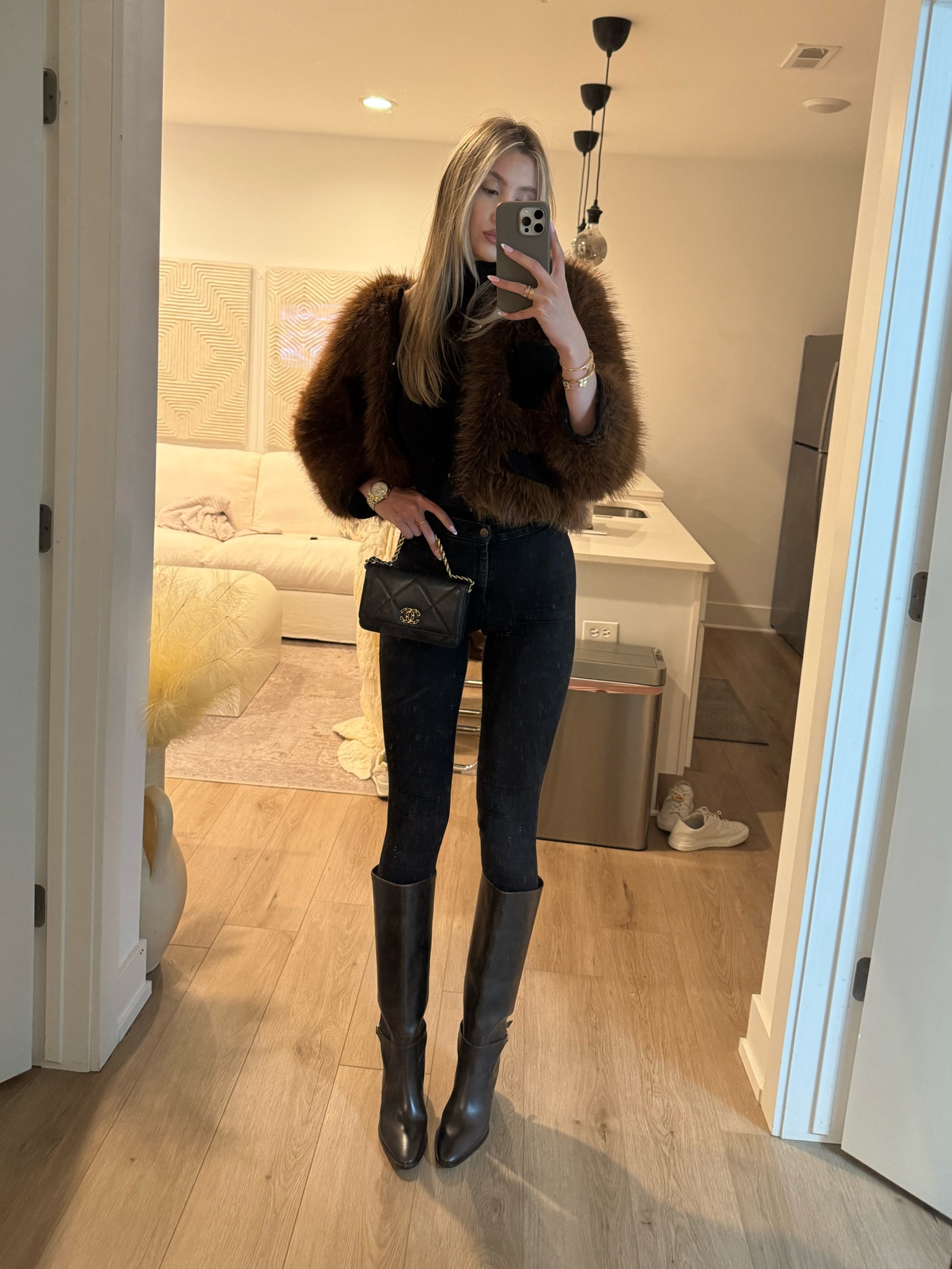 Black and brown- skinny jeans, boots and fur 