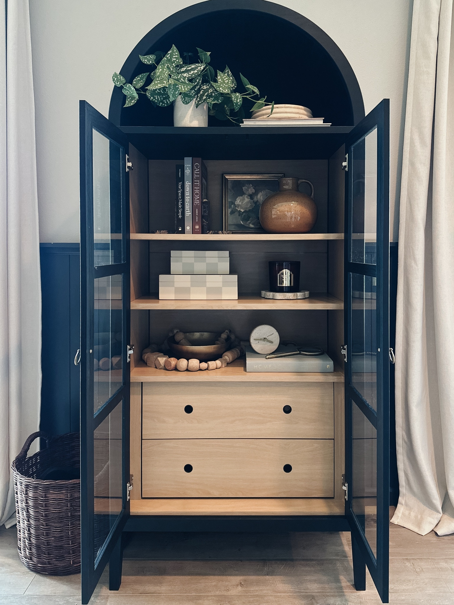So excited to finally be sharing our new arched cabinet!😍 love that I get to display all my pretty things & it provides functional storage!

Black and wood arched cabinet, Amazon find, target find, target home decor, Etsy home decor, marble bowl, Studio McGee decor, McGee and Co, Hearth and Hand home decor, checkered decor boxes, wooden decor beads, walnut wicker basket, marble clock, brass magnifying glass, coffee table books, brass art frame, burgundy fall candle, marble candle tray, marble bookends, faux pothos plant, ceramic vase, brass bowl

#LTKStyleTip #LTKHome