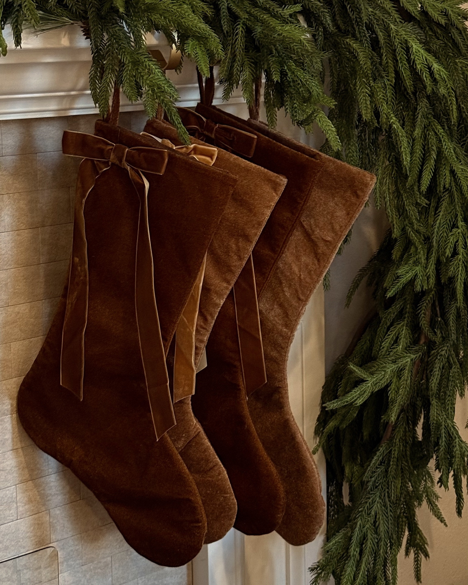 Found the perfect velvet stockings for the Holidays! Styling with some garland for a cozy look. 🌲

#LTKFindsUnder50 #LTKHoliday #LTKHome