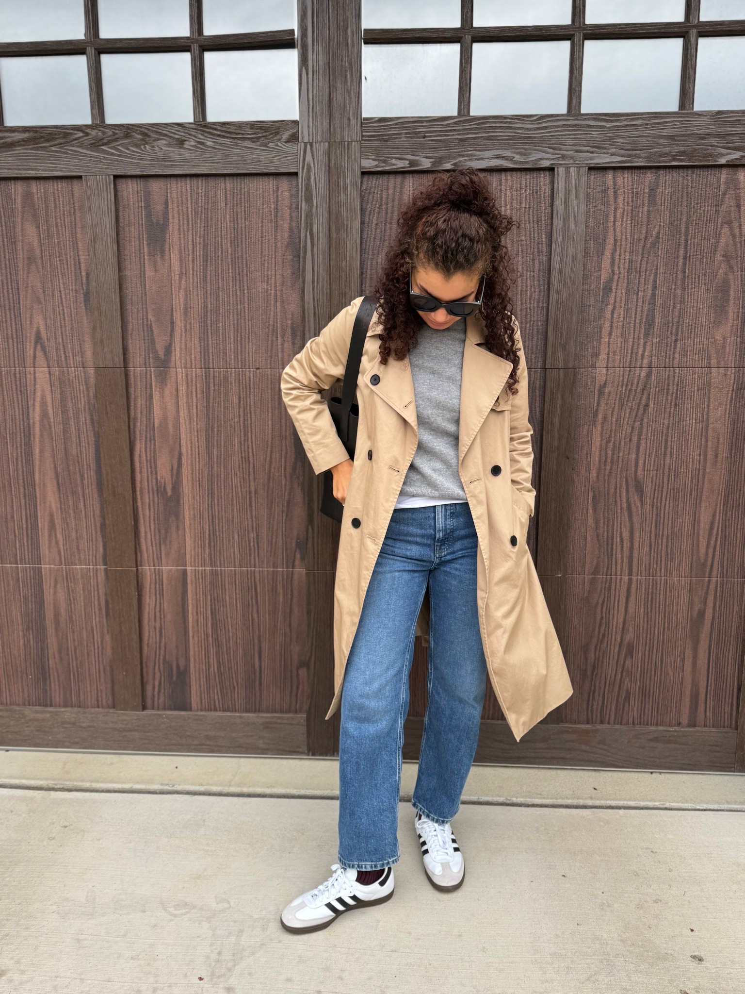 Casual chic outfit: jeans, white t-shirt, cashmere sweater, trench coat, sunglasses, bucket tote bag, sneakers, burgundy socks 

#LTKStyleTip #LTKSeasonal