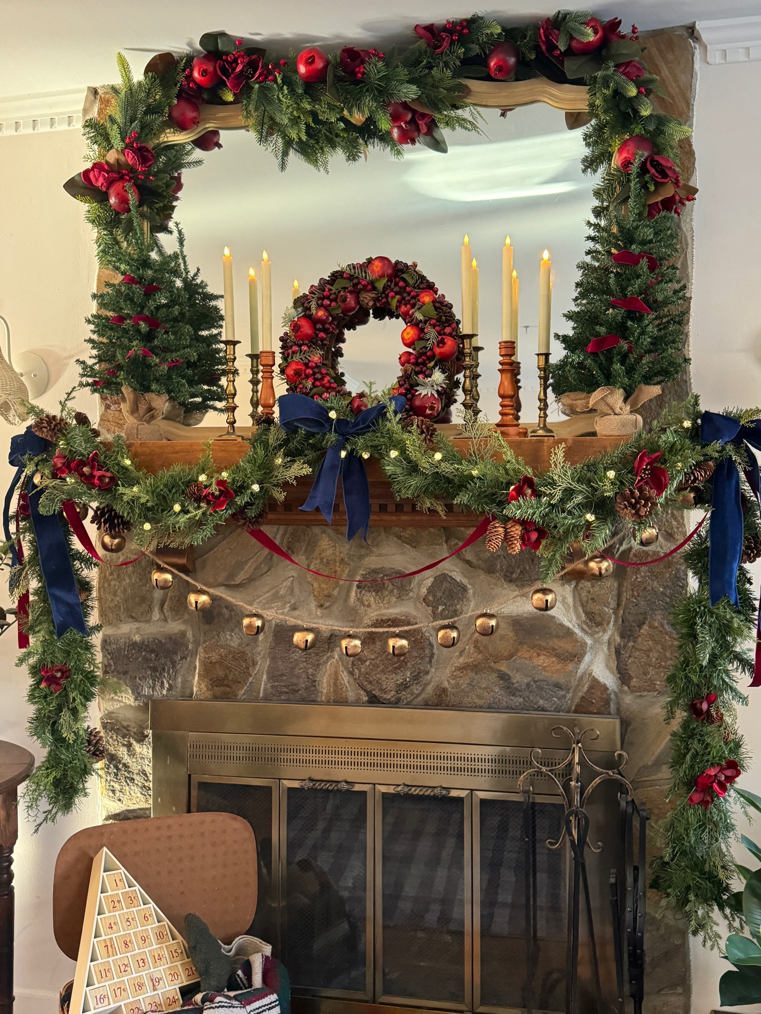 Maximalist English Cottage Christmas mantle decor. Pomegranate apple pinecone wreath is a vintage find along with the advent and picnic basket. Fireplace. 

#LTKSeasonal #LTKHoliday #LTKhome