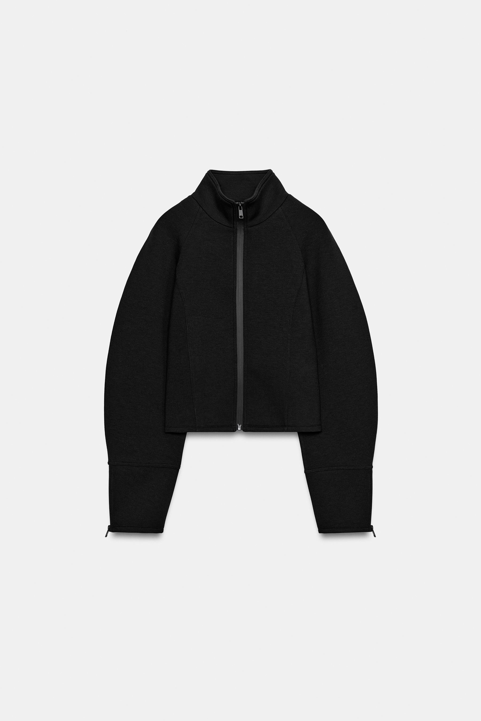 High-neck jacket with long sleeves and zipped cuffs. Featuring heat-sealed front zip fastening. | Zara UK