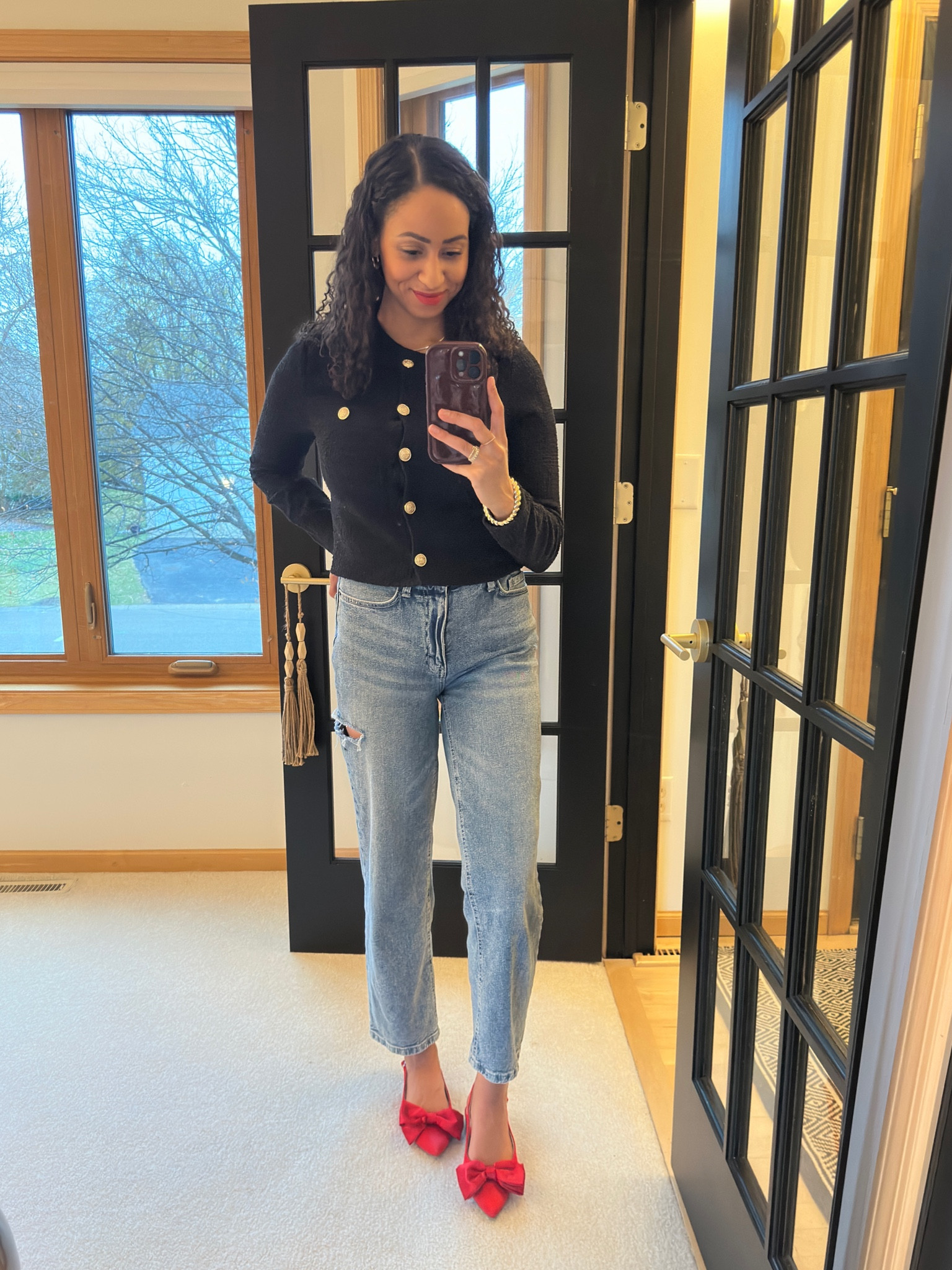 I changed from a cream sweater to this black cardigan before picking up my toddler from school. Always a little risky in light colors with a toddler 😅.

A simple black cardigan can make you feel totally put together while keeping it more relaxed in denim. I’m loving these red bow shoes for the pop of color and the holiday season ❤️🎄.

#LTKWorkwear #LTKShoeCrush #LTKHoliday