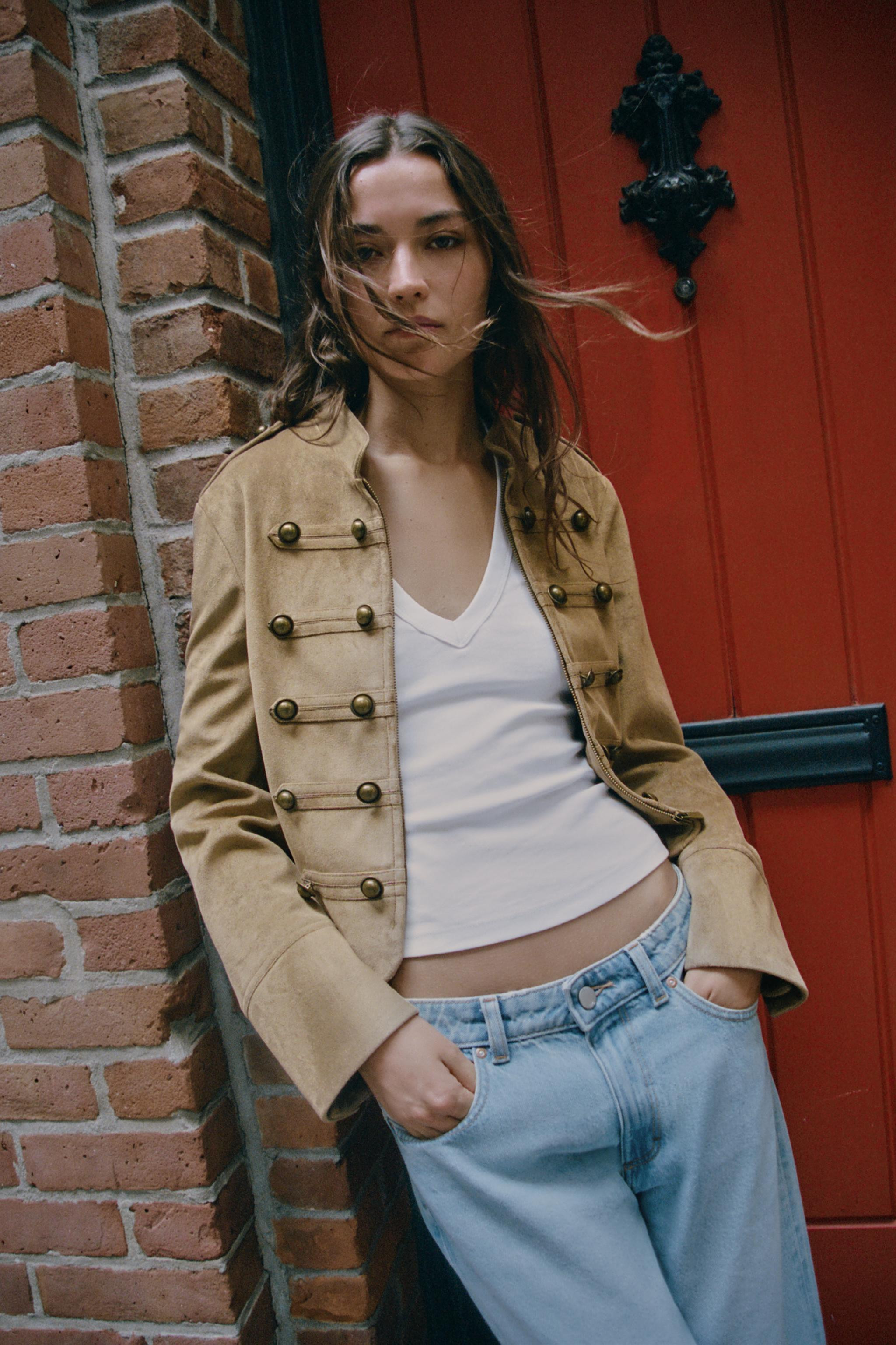 Faux-suede jacket featuring a high collar and long sleeves with shoulder tabs. Faux front button ... | Zara US
