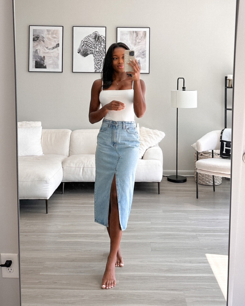 Denim midi skirt back in stock and on sale! One of my favorite spring staples 🤍

#LTKSeasonal #LTKfindsunder100