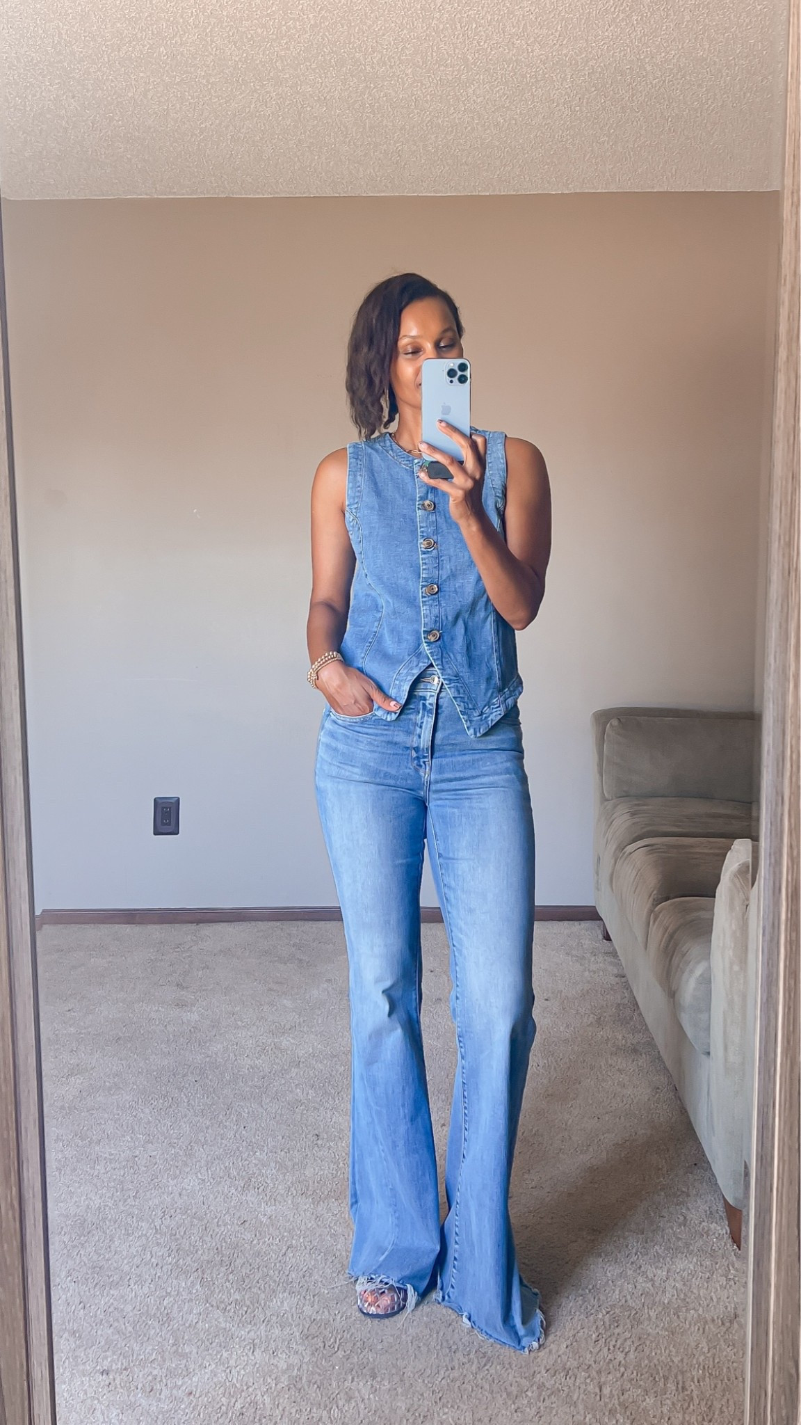 Denim on denim casual outfit idea with a vest and flare jeans.

#LTKootd #LTKOver40 #LTKTall