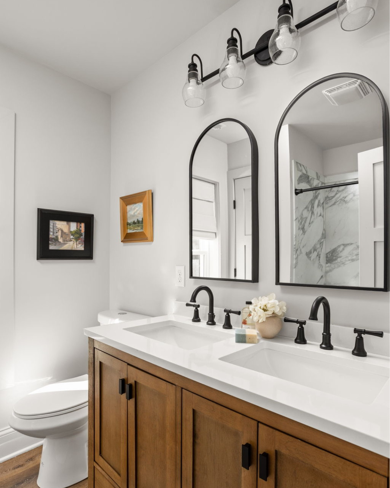 A wood tone vanity completes the cabin chic aesthetic.

#LTKhome