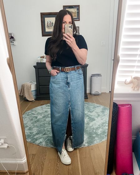 Spring outfit / rodeo outfit / western wear / denim maxi skirt / black T-shirt / brown belt / white sneakers / casual petite fashion

#LTKSeasonal #LTKfindsunder100 #LTKshoecrush