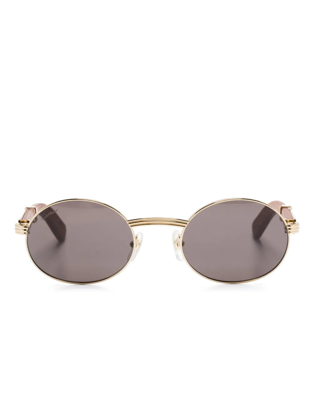Cartier Eyewear oval-frame sunglasses - Gold | Farfetch Global