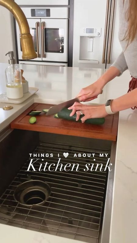 Obsessed with our stainless under mount kitchen sink. The built in cutting board, colander, and drying rack that all nest and tuck away are so convenient and pretty! 

#LTKhome