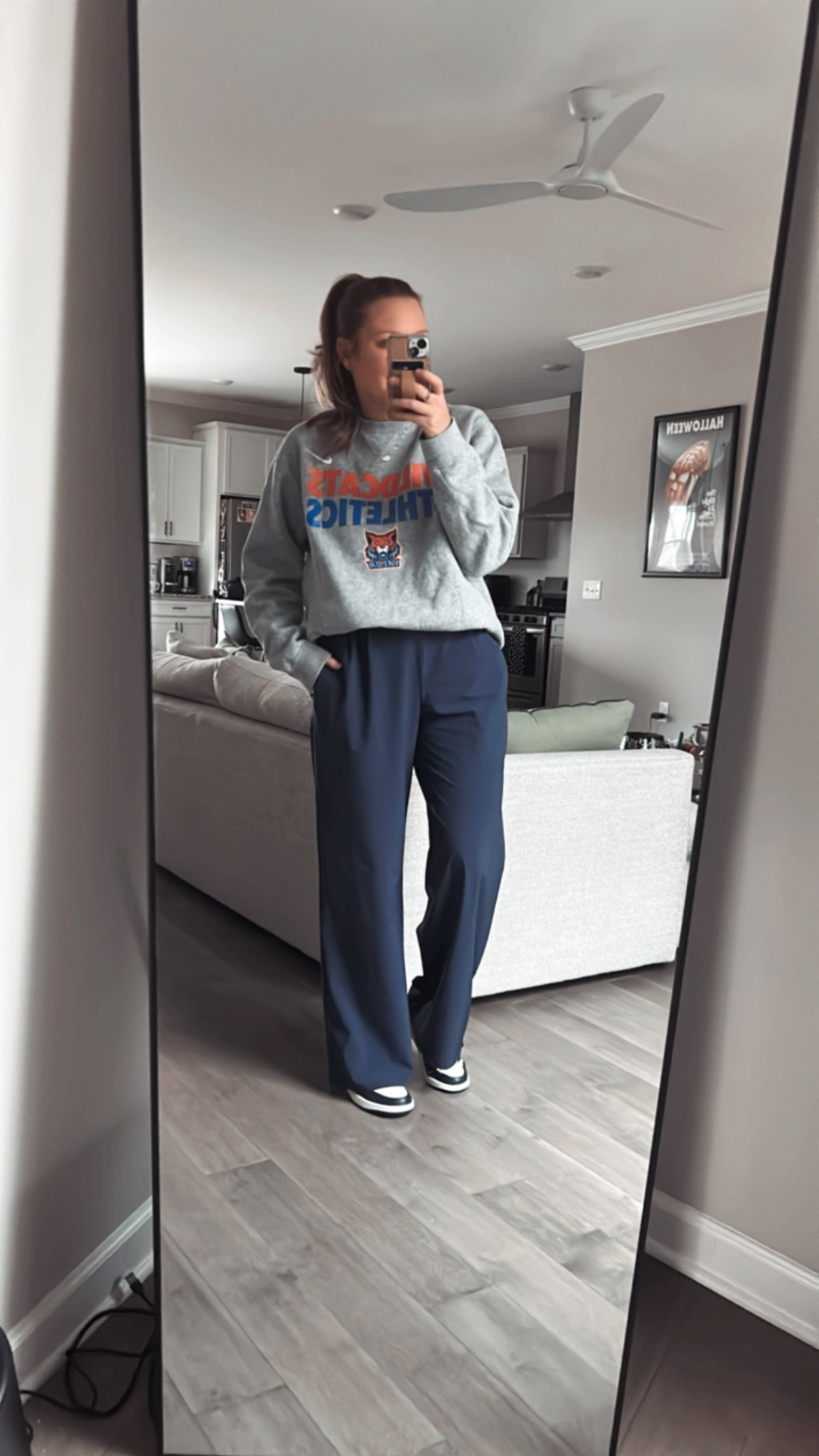 Game day outfit 
Nike sweatshirt 
Navy wide leg athletic pants / tts wearing a medium 
Navy and white sneakers / tts 

#LTKootd #LTKSaleAlert #LTKActive