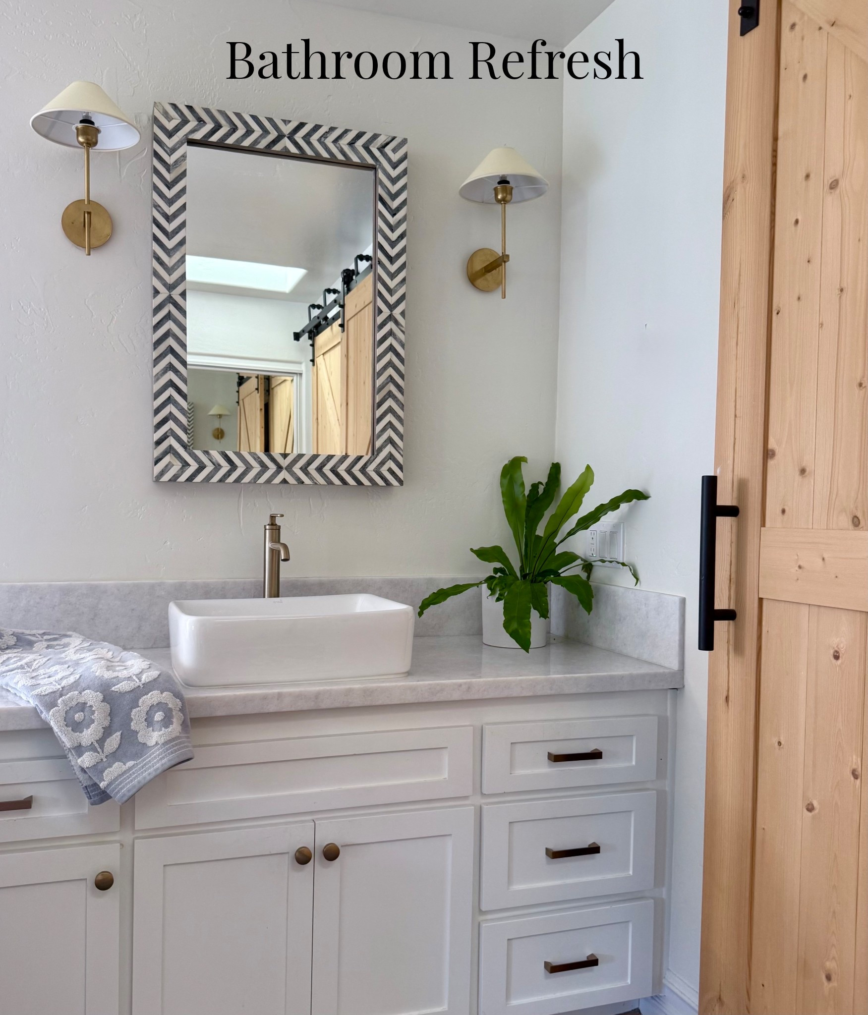 I remodeled my bathroom which desperately needed it. Think 1987 vibes! 🤍

I added new white marble countertops, cabinets, sink, Serena and Lilly light fixtures, West Elm mirror, new brass hardware, and a barn door closet. 🌿

I’m so happy with how my bathroom refresh turned out. Check out the before pictures on my Insta account @marneys_tidbits 🌸#LTKFindsUnder100

#LTKHome #LTKvlog