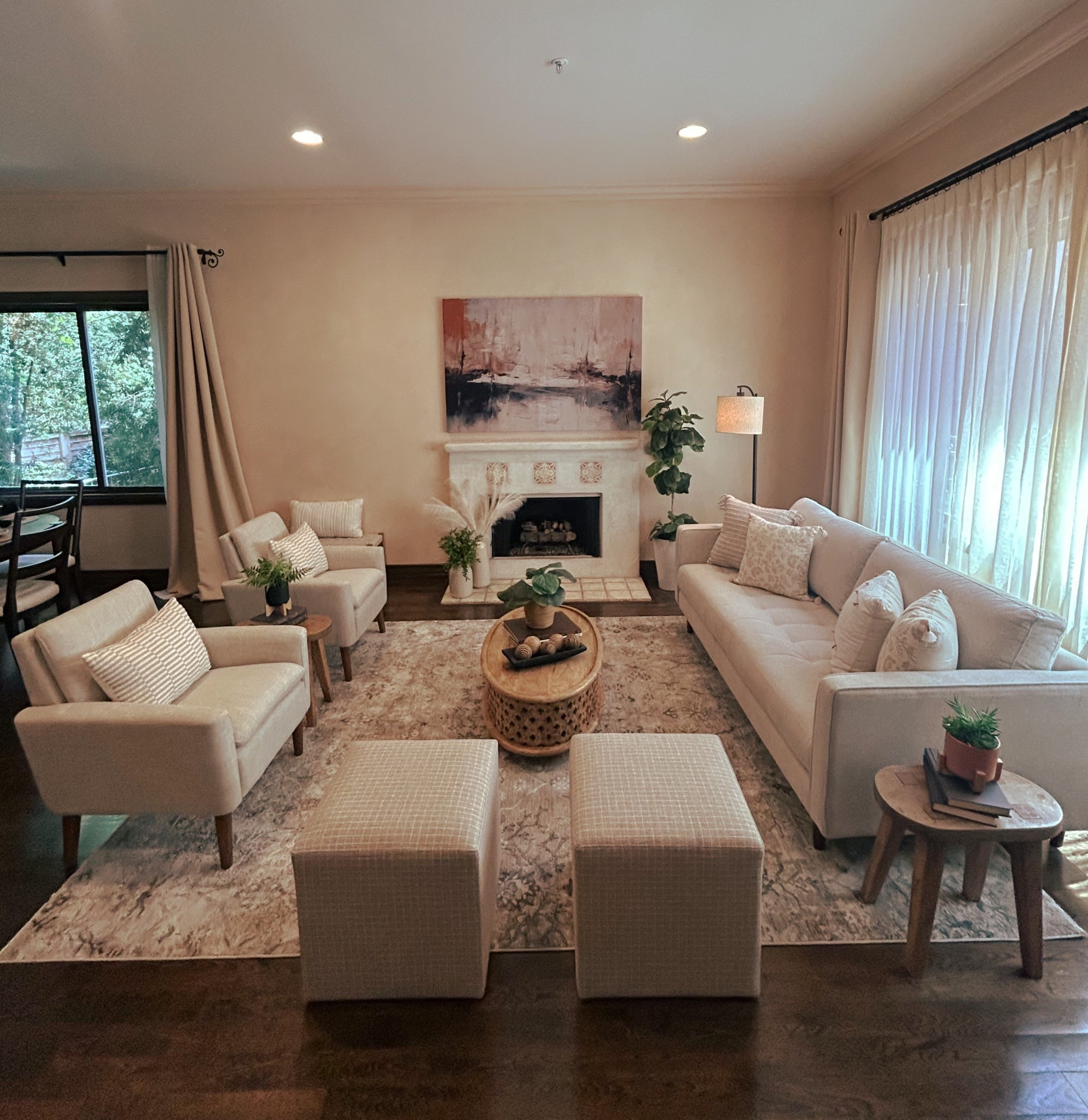 Living room for a client who requested warm neutrals. Neutral home decor

Rug was purchased at Ross
Couch is from Living Spaces, accent chairs from TJ Maxx and coffee table was from World Market.  Artwork was a shower curtain stapled over an old large piece of art, shower curtain linked  

#LTKHome