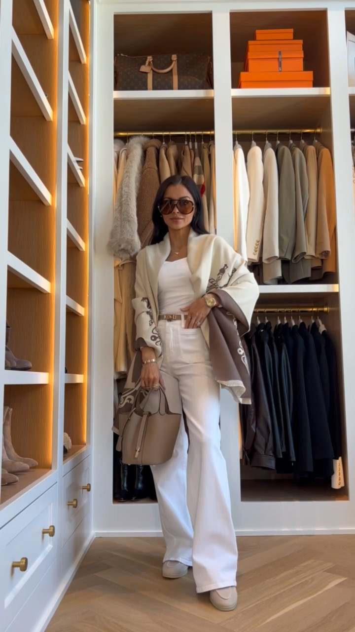 An Amazon shawl that truly looks designer. The oversized silhouette, luxe weight, and classic equestrian inspired print make it feel high end and timeless. I love how the reversible neutral tones instantly elevate a simple white tank and wide leg denim, adding that polished, layered look without trying too hard. It is the perfect travel wrap, lightweight layer, and statement accessory all in one. Such a chic luxe look for less piece.

MiaMiaMine Amazon shawl designer inspired wrap luxe look for less equestrian print shawl neutral layering piece oversized wrap women chic fall outfit elevated everyday style travel wrap scarf Hermes inspired shawl classic neutral wardrobe statement accessory

#LTKSeasonal #LTKootd #LTKWorkwear