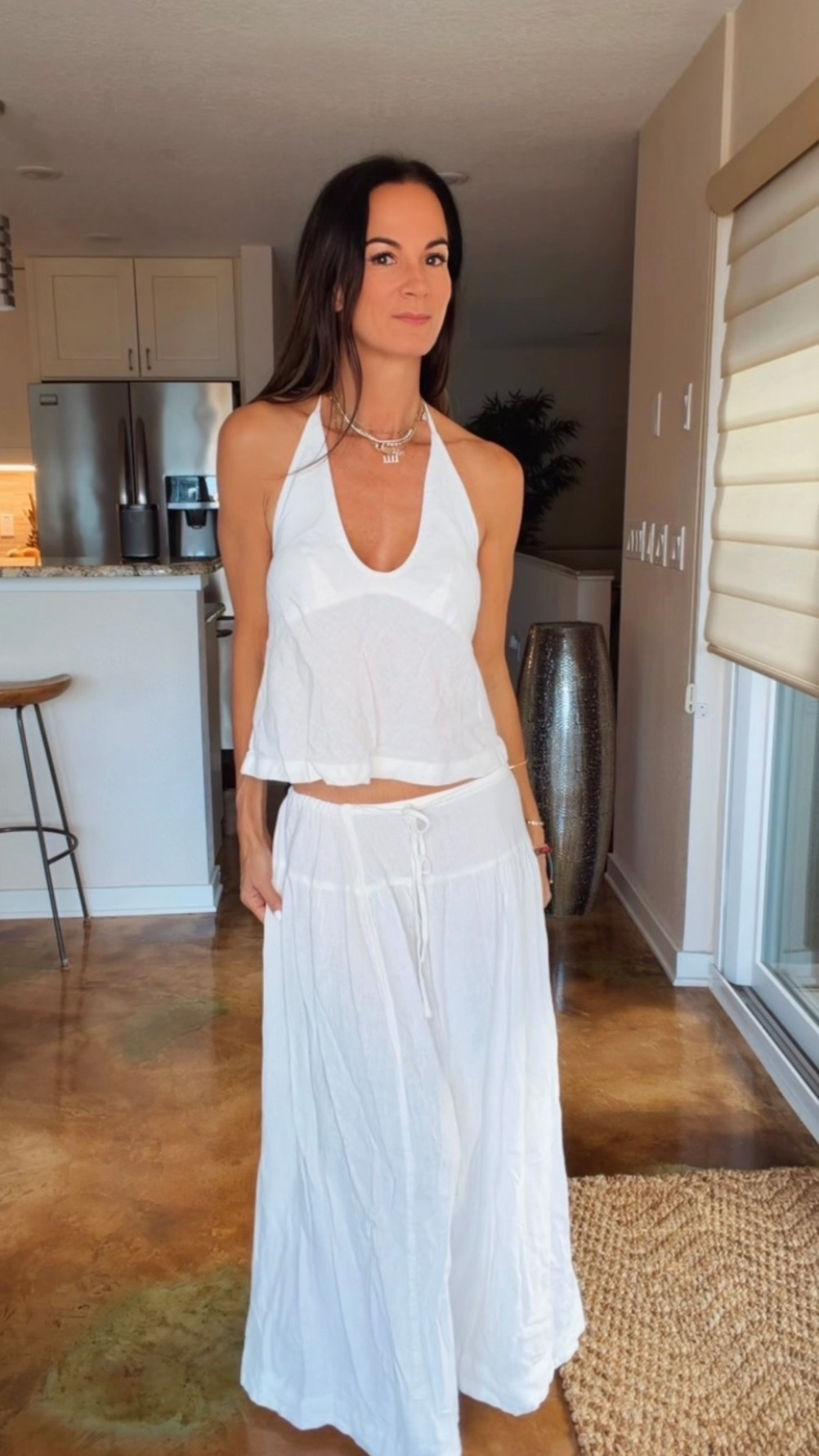 POV: You find the kind of outfit that makes you want to book a vacation immediately. 🤍✨

This little linen set is giving effortless coastal chic and I am HERE for it. Lightweight, breezy, and the open-back halter top? She’s the moment. The flowy maxi skirt moves so beautifully, and together they look way more expensive than they are.

It’s one of those throw-on-and-go outfits that somehow still looks like you spent way more time getting ready than you actually did… my favorite kind. 🤍

Beach dinners, resort mornings, brunch, vacation strolls… this set is coming with me everywhere this summer.

#summerstyle #linenset #coastalstyle #vacationoutfit #resortwear

#LTKdayinmylife #LTKgrwm #LTKootd