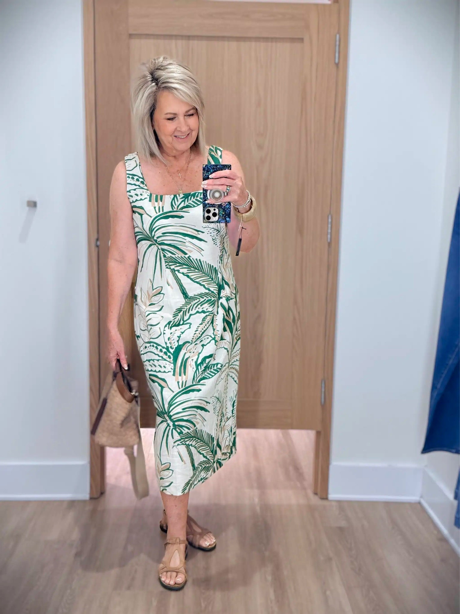 Doesn’t this midi dress just scream vacation? This one would be going on any trips with me because it is perfect for vacation, lunch or an evening out. I’m wearing a size 12.

#LTKTravel #LTKOver40 #LTKootd