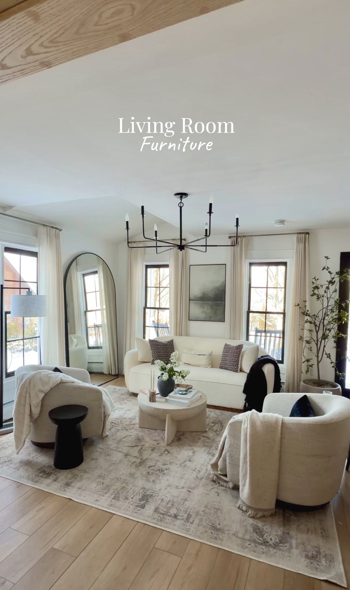 My small neutral living room decor and furniture 

🏷️ small living room / abstract art / boucle couch / swivel chairs / coffee table / west elm/ living room chandelier / side table / accent table / curtains / pinch pleat curtains / oversized mirror / living room rug / huggable