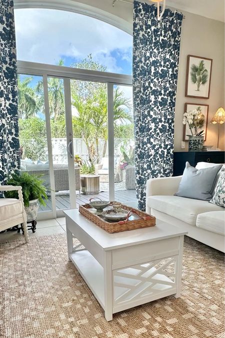 Coastal living room sources, affordable sofa, pillows, white coffee table, blue and white curtains, patterned curtains

#LTKHome